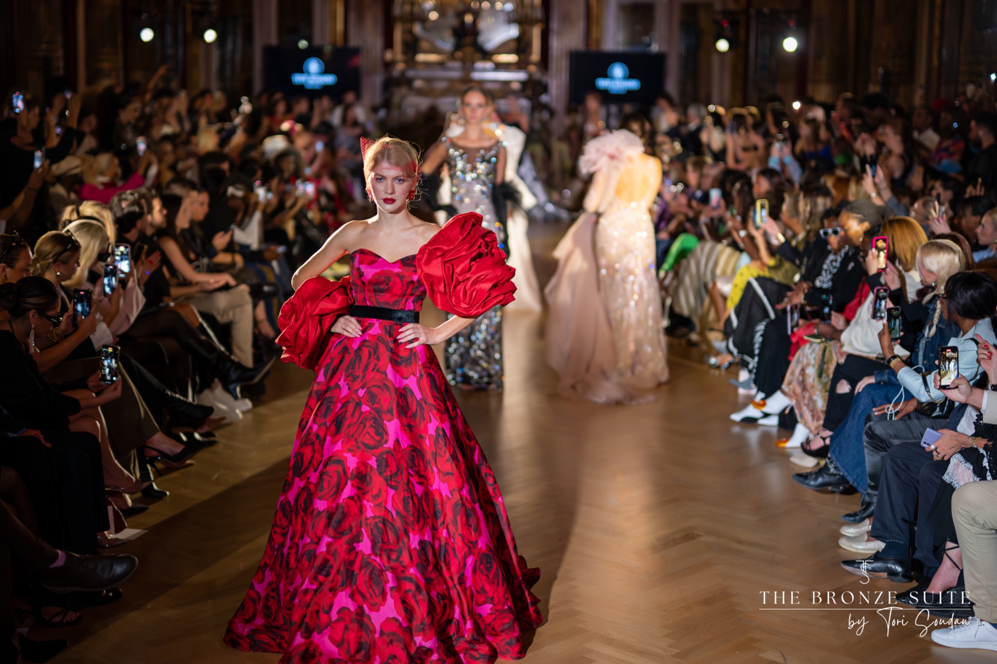 Fashion runway with model in red gown